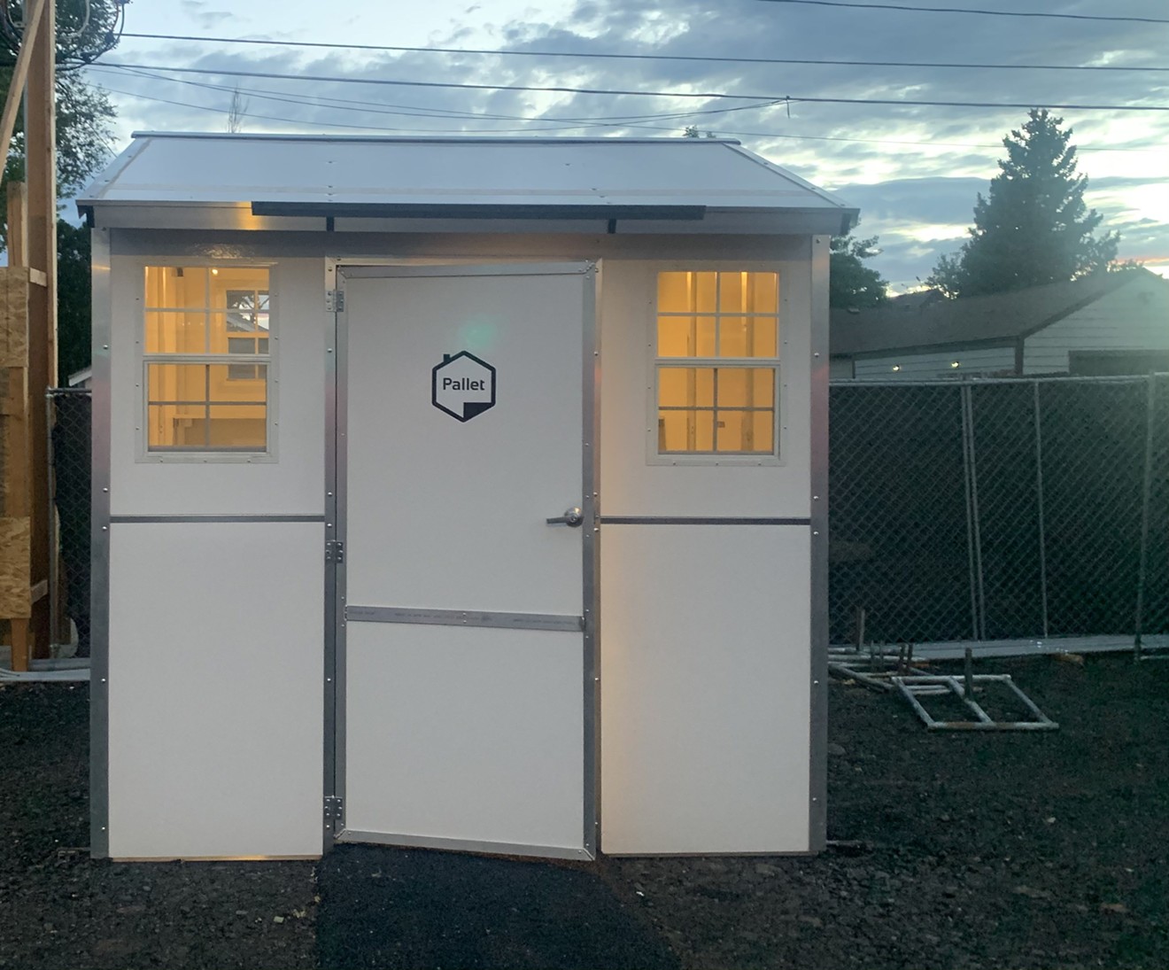 The pallet shelter includes lighting and electric outlets.
