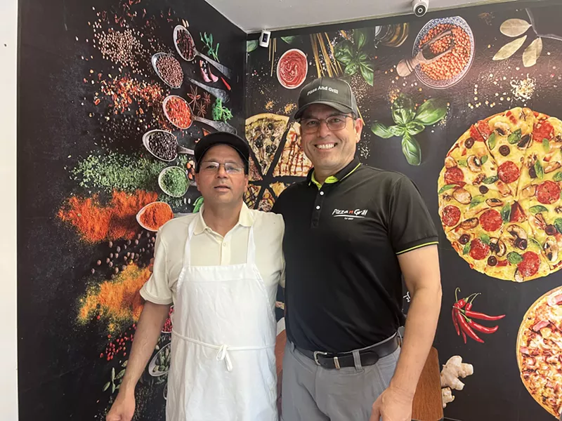 Image: two men in restaurant