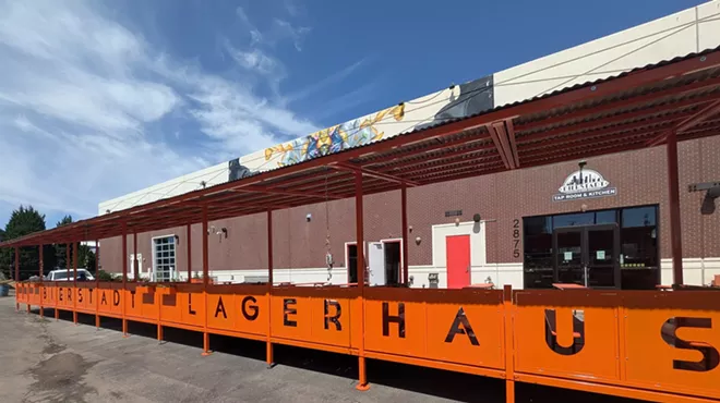 Covered patio with orange metal work.