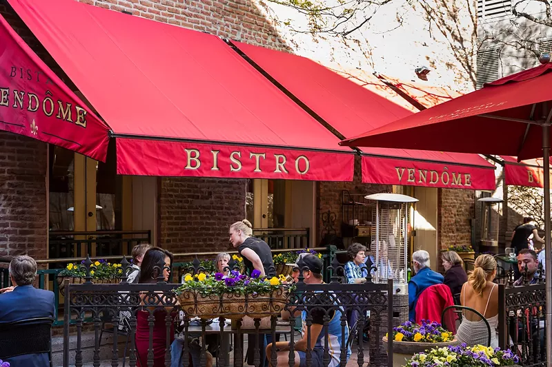 Image: Duck through the arched passageway from Larimer Street into a courtyard to find Bistro Vendôme.