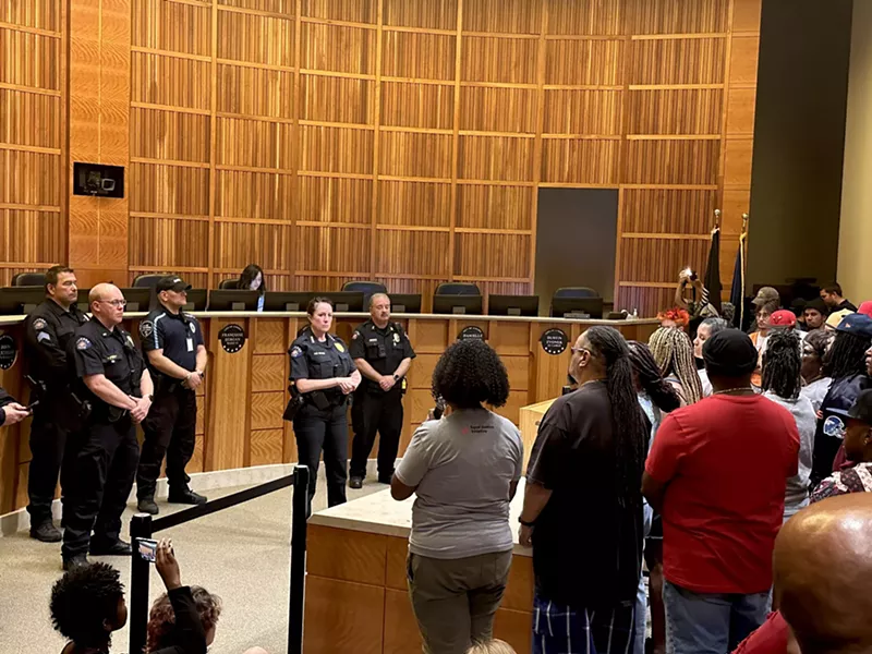 Image: Police speaking and listening to protesters.