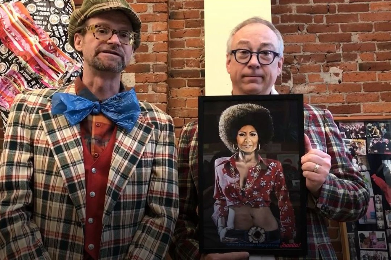 Voodoo Doughnut founders Tres Shannon (left) and Kenneth Pogson with a reproduction of the Pam Grier painting that was stolen from the Denver doughnut shop.