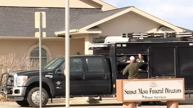 Image: An investigator outside the Sunset Mesa funeral home in Montrose.