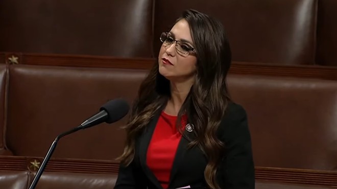 woman in red shirt in Congress