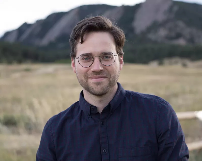 Image: CU Boulder professor Nathan Schneider reads at BookBar on September 14.