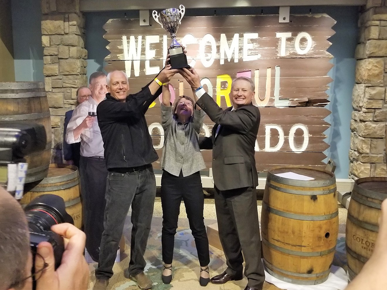 John Garlich (front left) and Ulla Merz (center) of Bookcliff Vineyards accept the 2018 Governor's Cup.