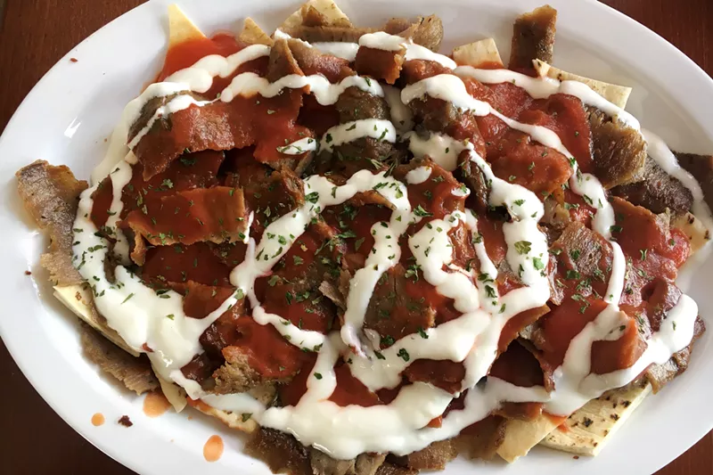 Image: Iskender kebab is a traditional Turkish dish served with tomato sauce and yogurt.
