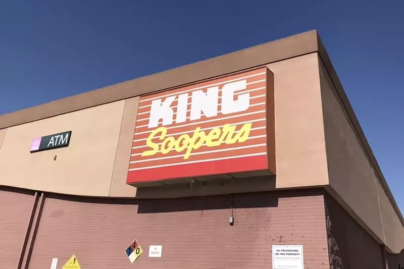 Image: The brick exterior and large red retail sign at King Soopers in Denver
