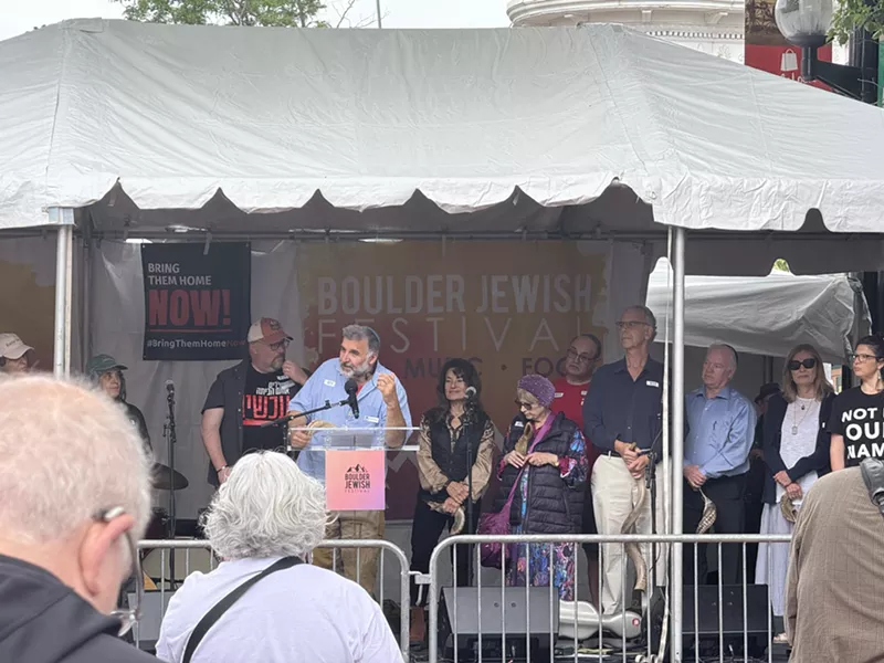 Image: Rabbi Marc Soloway of Congregation Bonai Shalom in Boulder addresses attendees at the Boulder Jewish Festival a week after the firebombing terror attack