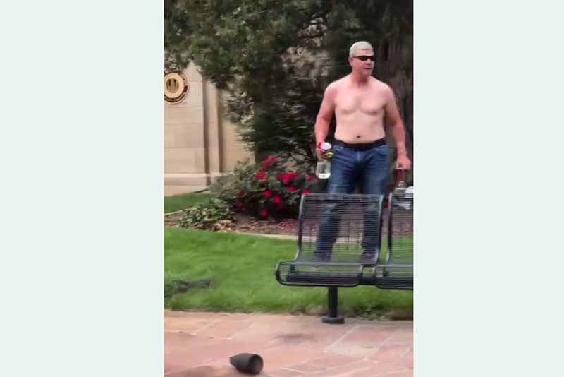 Image: Boulder fire attacker stands wihtout shirt on