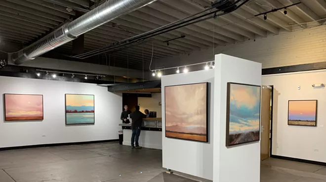 The interior of an art gallery on a slow day.