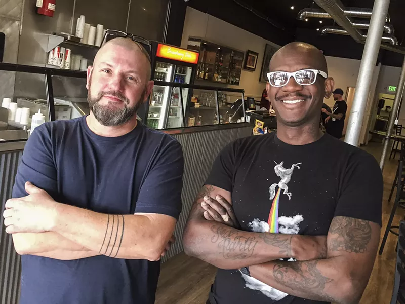 Image: Brett Neilley (left) and Jermaine Smith stand inside Broadway Deli, their new restaurant at 8 South Broadway.