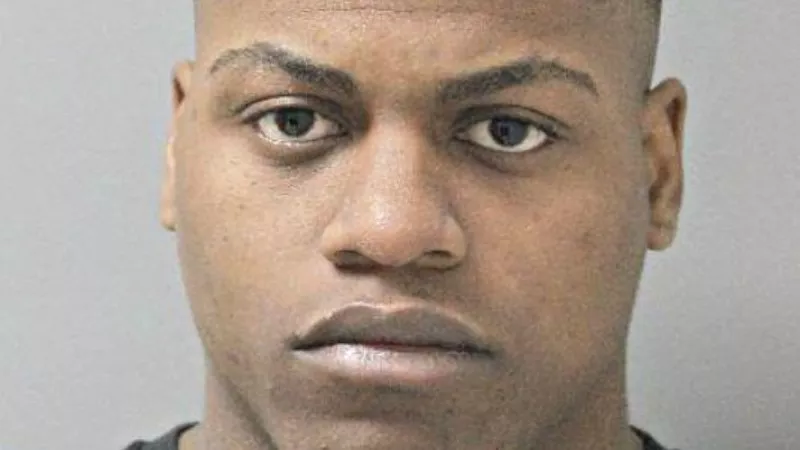 Image: Carlos Henderson's booking photo.