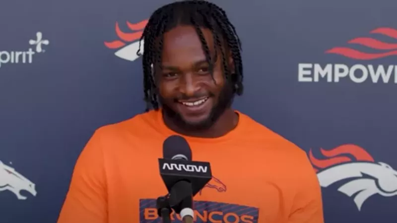 Image: NFL player Javonte Williams during post-game press conference