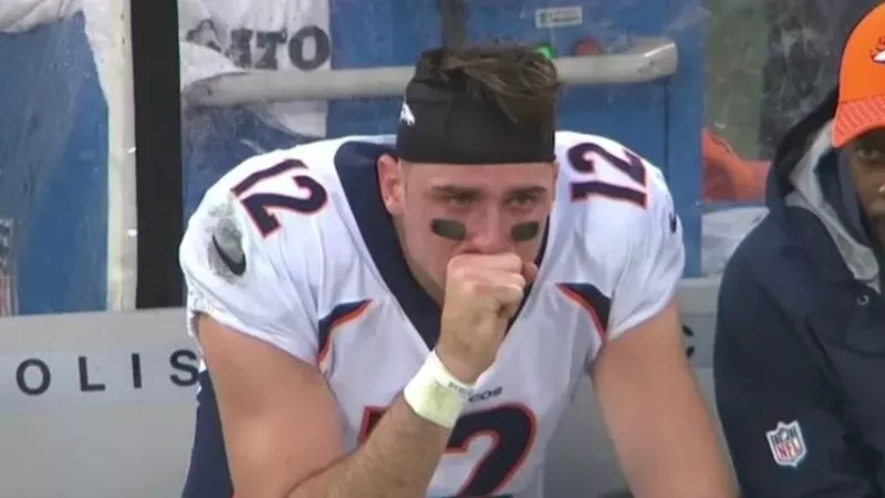 Image: Quarterback Paxton Lynch crying on the sidelines during a game last November.