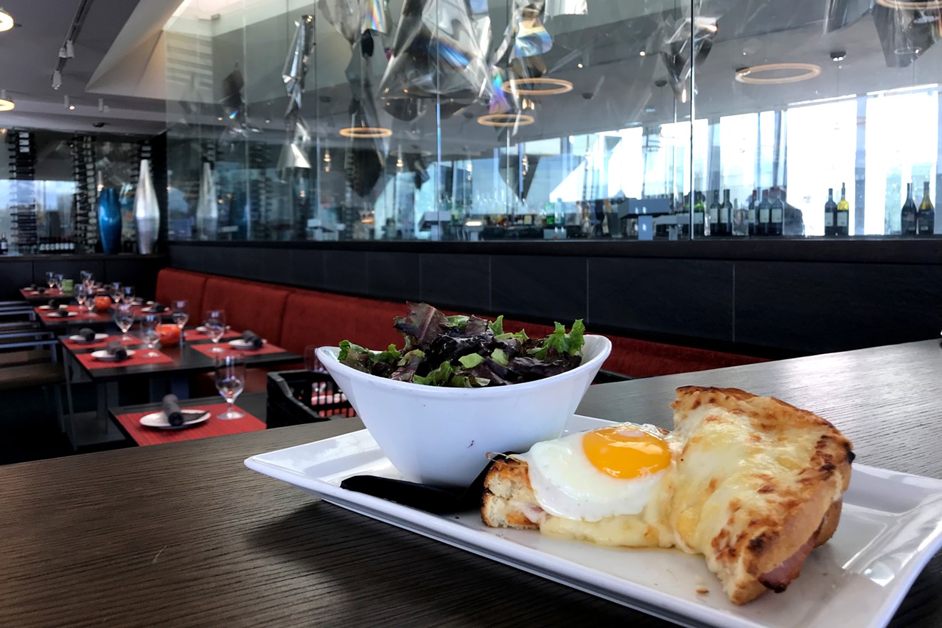 The croque madame at Fire, with an art installation in the background.