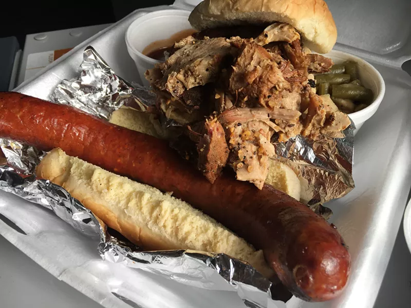 Image: Pulled pork and a spicy Gold Star hot link, along with green beans, barbecue sauce and buns to soak up the juices.
