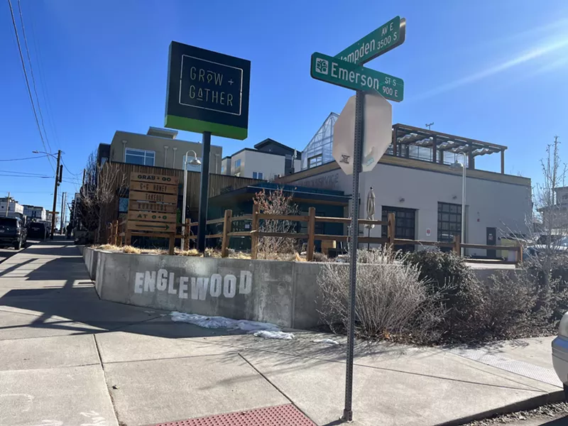 Image: a street sign in front of a building