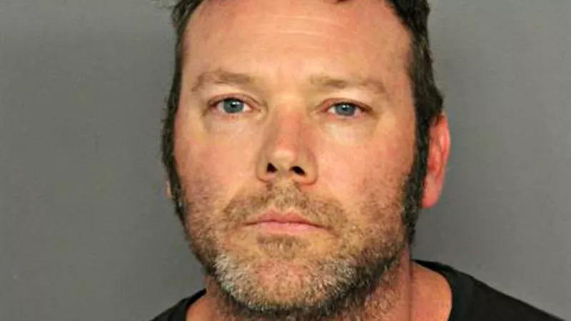Image: Officer Ryan Burke's booking photo.