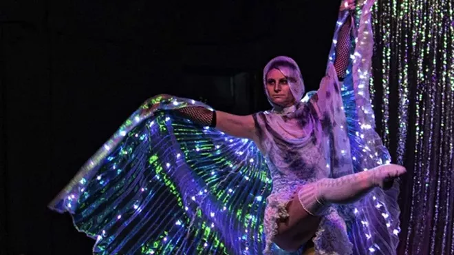 a woman wearing a lightup butterfly outfit