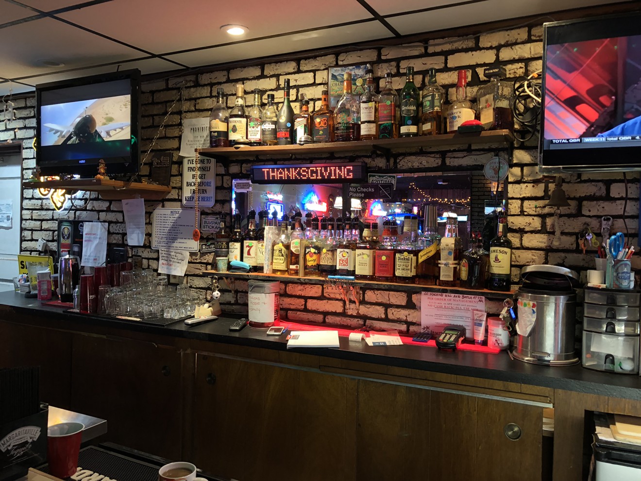 If you look closely, you can see the color-coded dots on each bottle of liquor behind the bar at Riley's Inn.