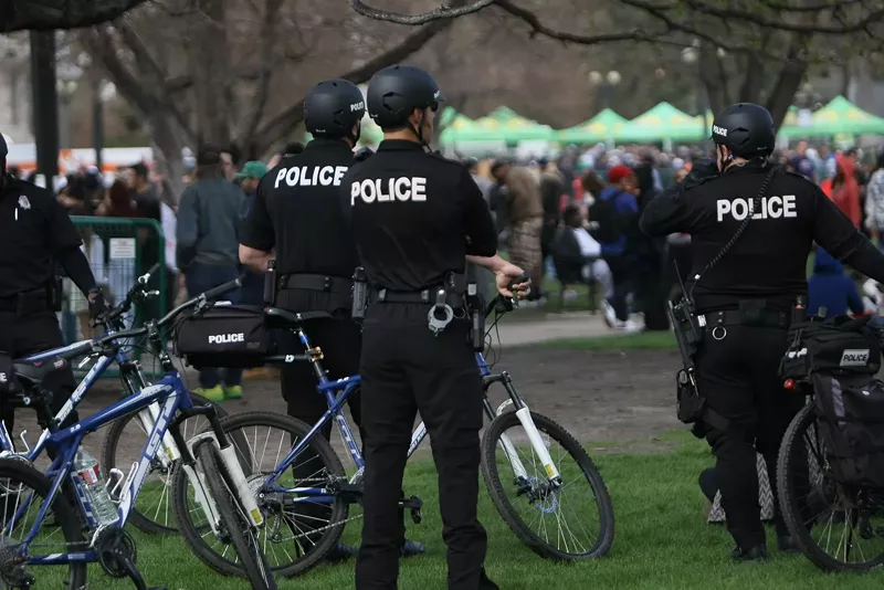 Image: Police oversee a 4/20 rally in Denver's Civic Center Park.