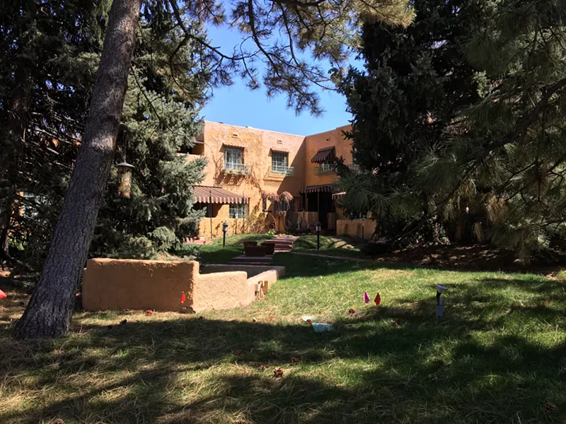 Image: After 95 years, Carmen Court has a park-like setting of mature trees.