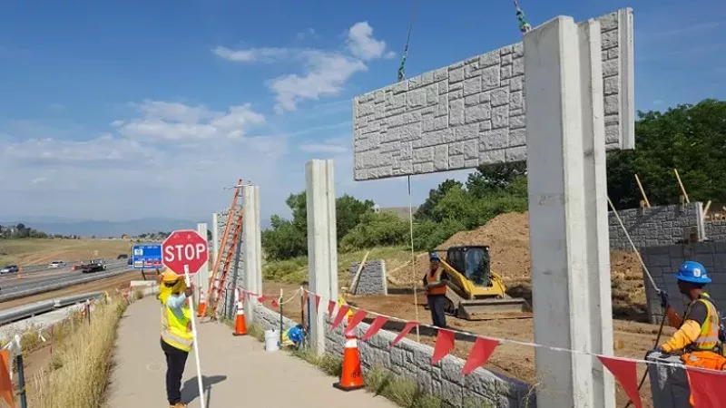 Image: A noise wall under construction as part of the C-470 project last year.