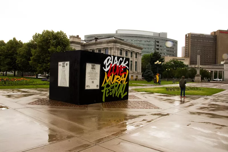 Image: A sign for the Black Love Mural Festival in Civic Center Park on June 19.