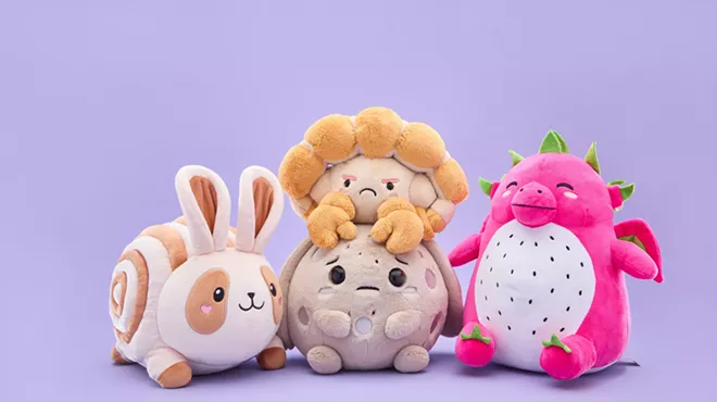Four cute food and space-themed plush toys have a distinct emotion on their face.