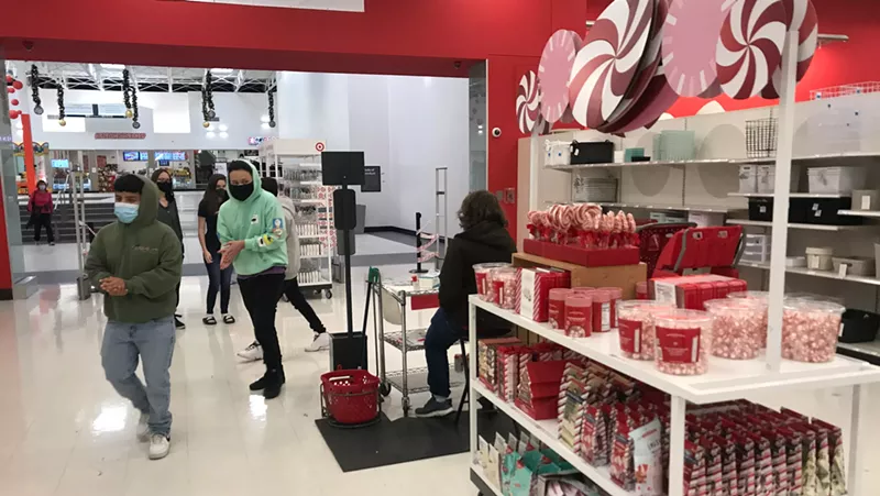 Image: A customer checkpoint at the mall entrance to the Target at Colorado Mills, which has not suffered a COVID-19 outbreak.
