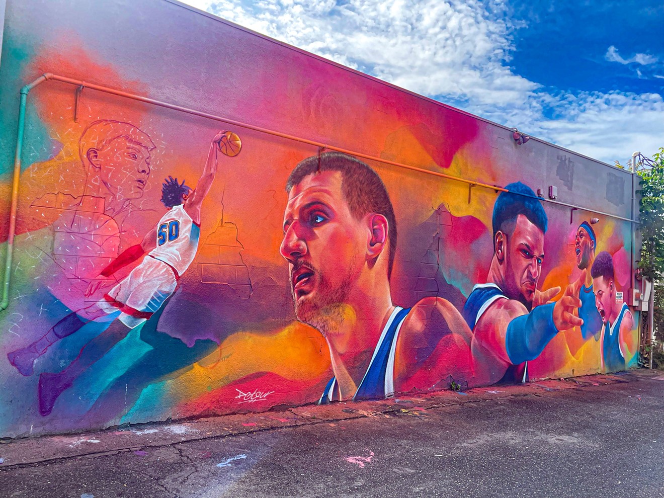 Detour's colorful mural in Denver of Denver Nuggets players Nikola Jokic and Jamal Murray, with more players to be added.