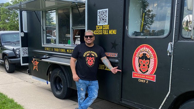 man standing in front of a food truck
