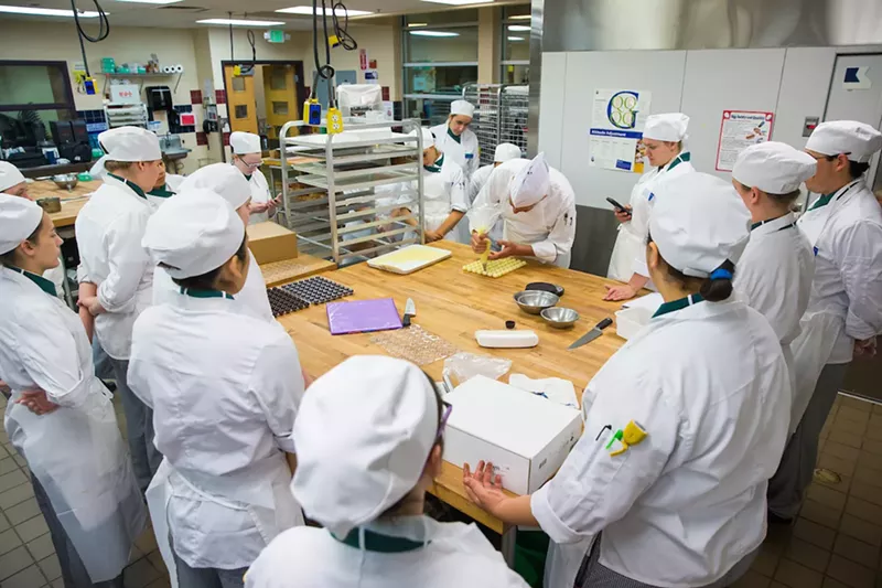Image: Chefs in training learn pastry skills in one of the classroom kitchens at Johnson & Wales University.