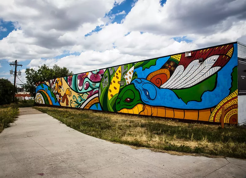 Image: The completed "Xipe Totec" mural, completed by Alicia Cardenas, Victor J. Escobedo, and Marco Antonio Garcia in collaboration with the Chicano/a Murals of Colorado Project.
