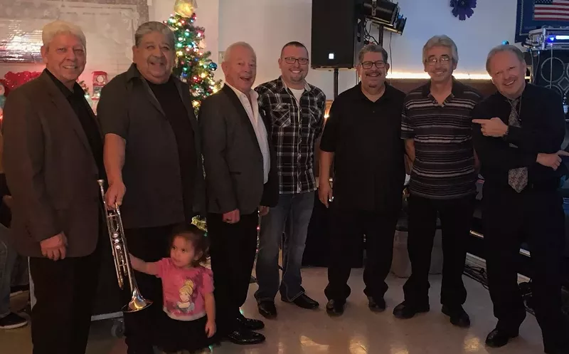 Image: Los Trujillos are (from left to right): Steve Trujillo, Charles Gallegos, James Trujillo, Jared Trujillo, Leonard Gallegos, Richard Gallegos and Augie Trujillo.