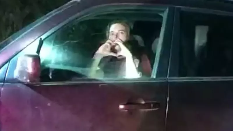 Image: Christian Glass made a heart-shaped gesture to officers who responded to his 911 call on June 10.