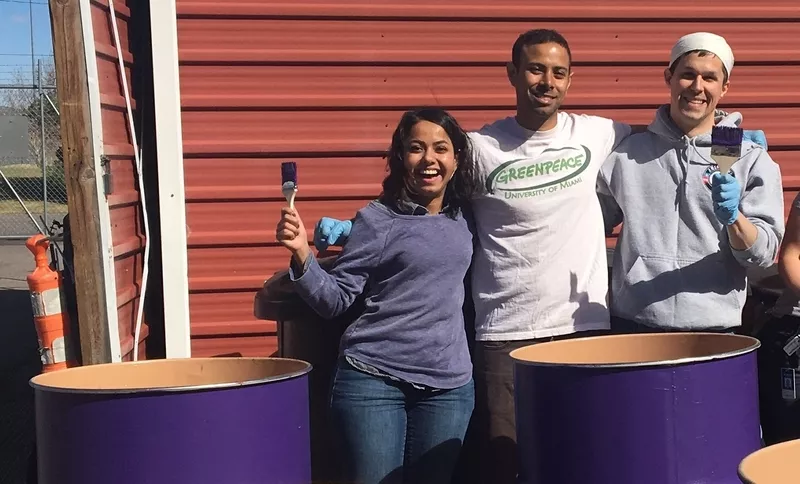 Image: Noor Shaikh, Alejandro Vera and Andy White pause during their bin-painting to pose.