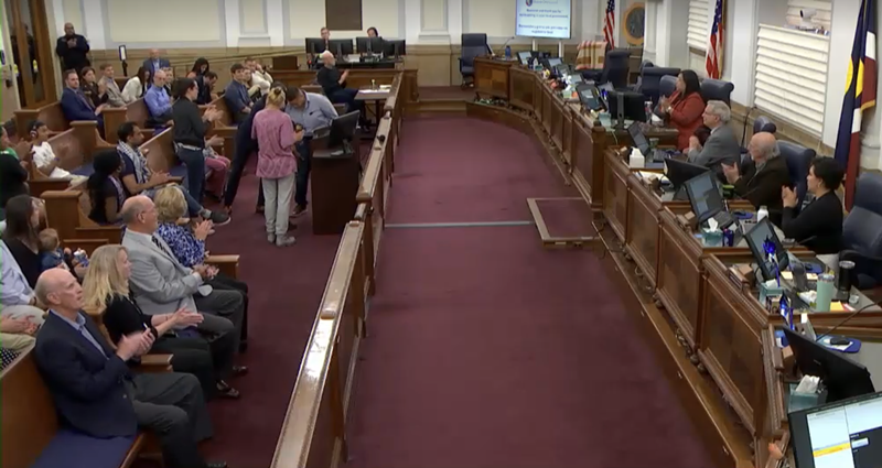 Image: Crowds surround Denver City Council during a meeting