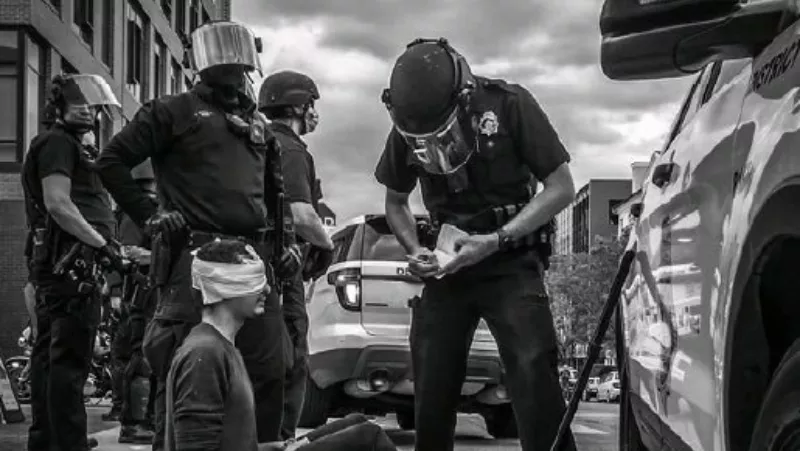 Image: Michael Acker after being shot in the eye during a Denver protest.