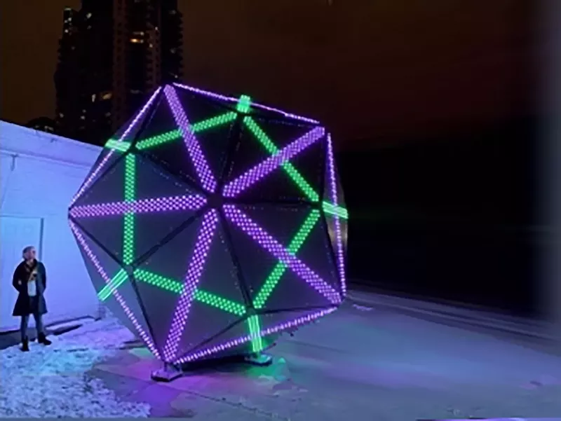 Image: Clark Richert's "Quadrivium" lit up at night.