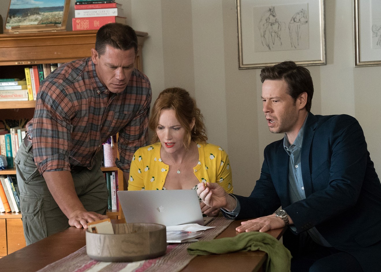 The cock-blockers of Blockers include (from left): John Cena as Mitchell, a butt-chugging father trying to stop his daughter from losing her virginity; Leslie Mann as single mom Lisa; and Ike Barinholtz as absentee father Hunter.