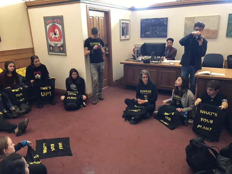 Image: Activists with the Sunrise Movement held a sit-in at Governor Jared Polis's office on December 6, 2019.