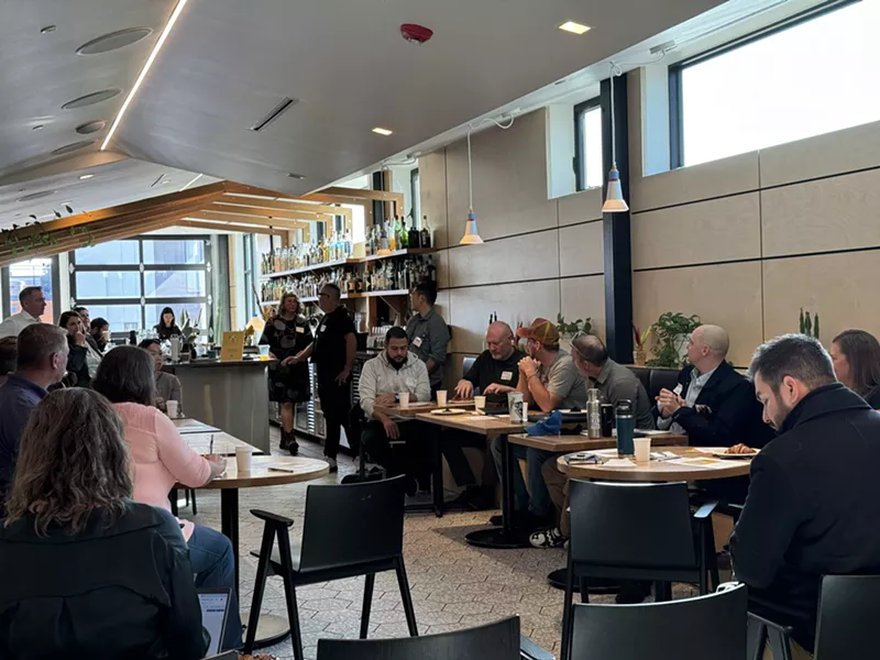 Image: a group of people seated at tables