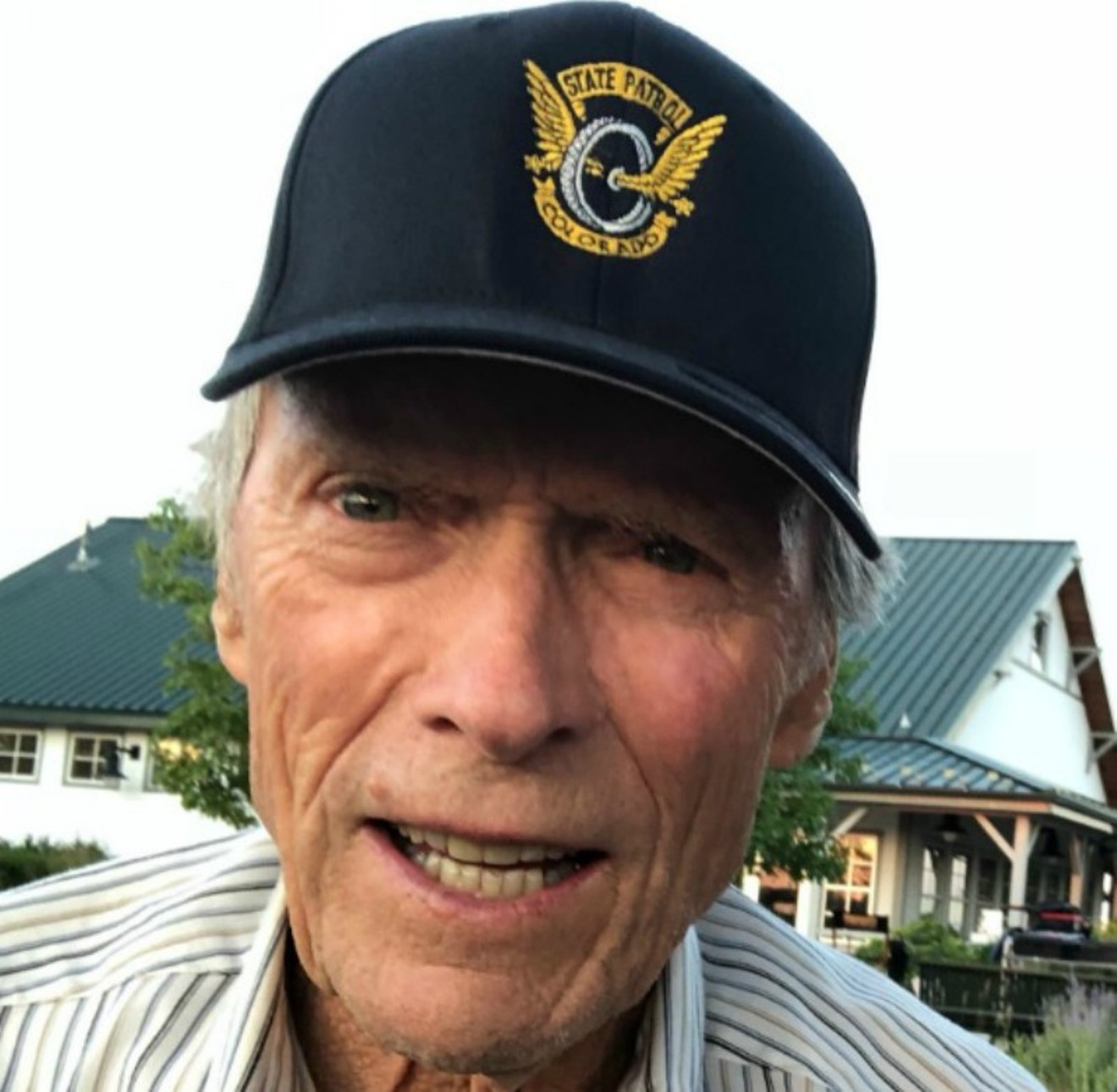 Clint Eastwood sporting a Colorado State Patrol cap during his visit to Colorado.
