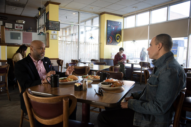 Image: Mayor Michael Hancock shares a meal with CNBC's Marcus Lemonis at the Welton Street Cafe.