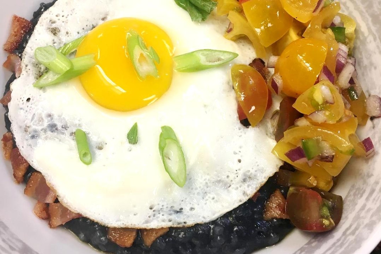 Eggs, bacon, peppers and more top charcoal-infused rice grits in the Coal Bowl.