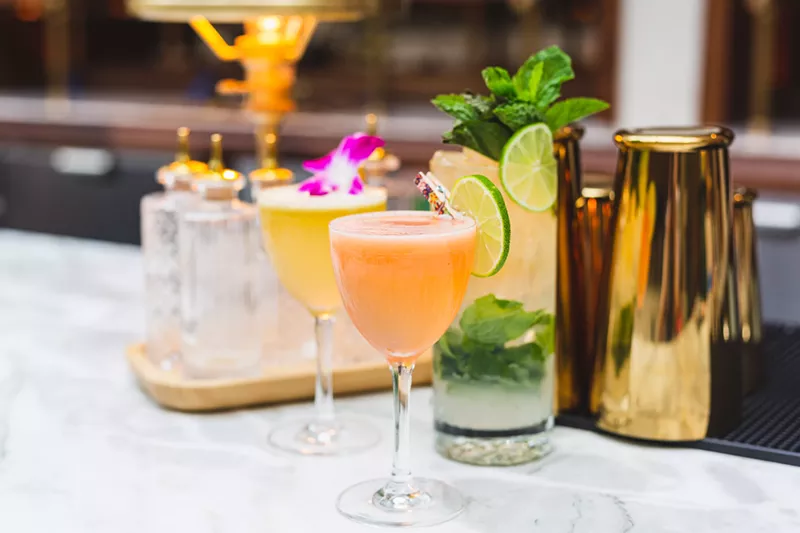 Image: colorful cocktails in glasses on a bar top