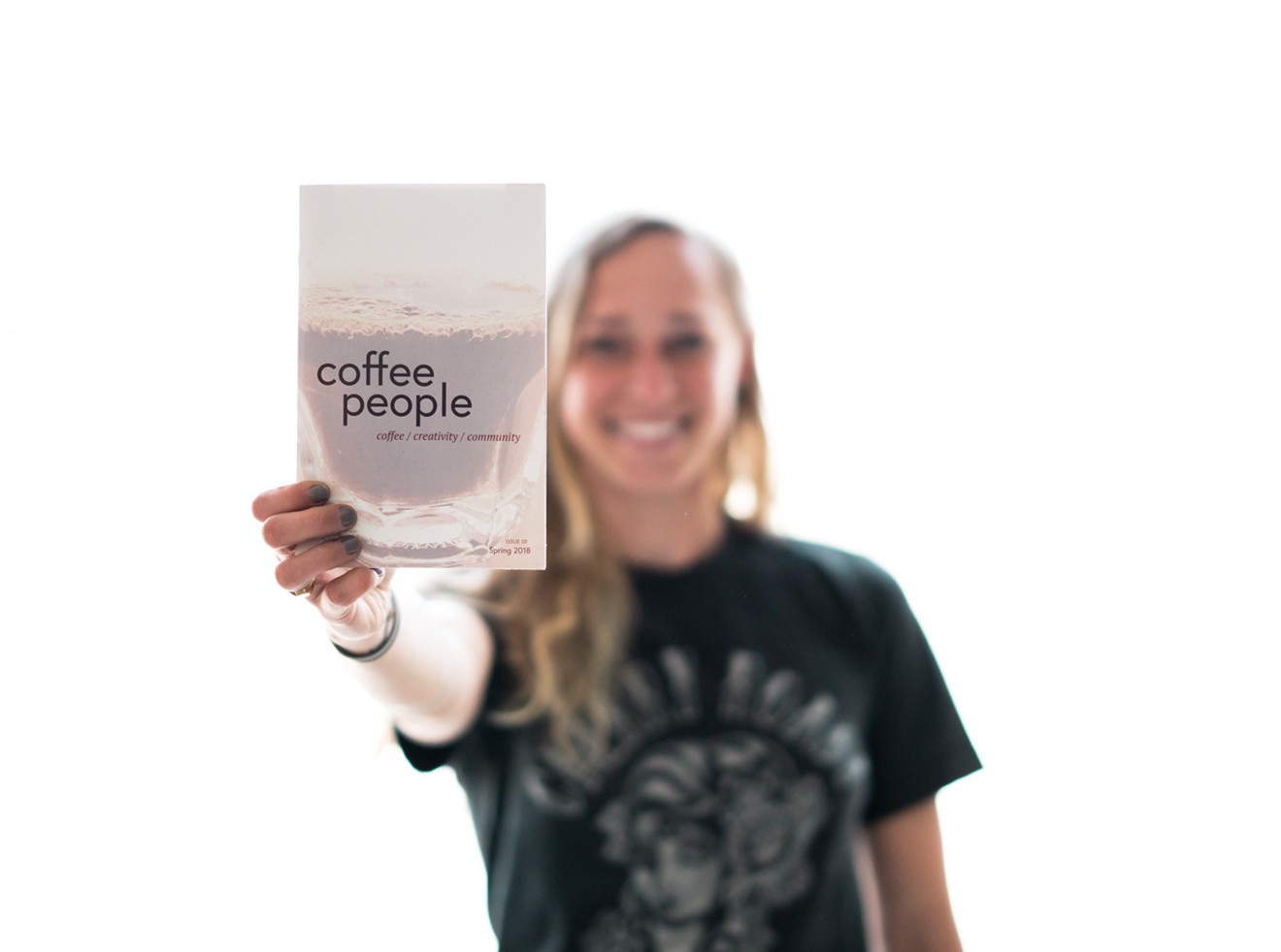 Kat Melheim shows off her zine, Coffee People.