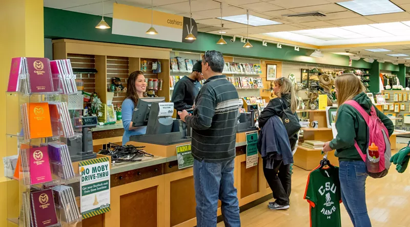 Image: Customers wait in line and purchase Colorado State University merchandise at the college bookstore.
